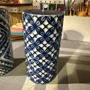 NEW. Gorgeous Blue and White Patterned Wax Candle. Brand new. Approx 6” tall